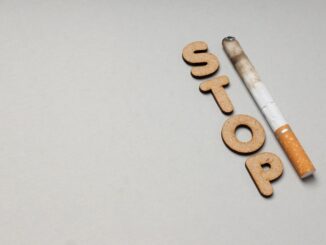 Concept of harm of smoking, text Stop and cigarette, space for text